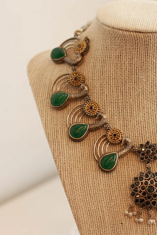 Beautiful German silver peacock design necklace set with gold and emerald color stone details
