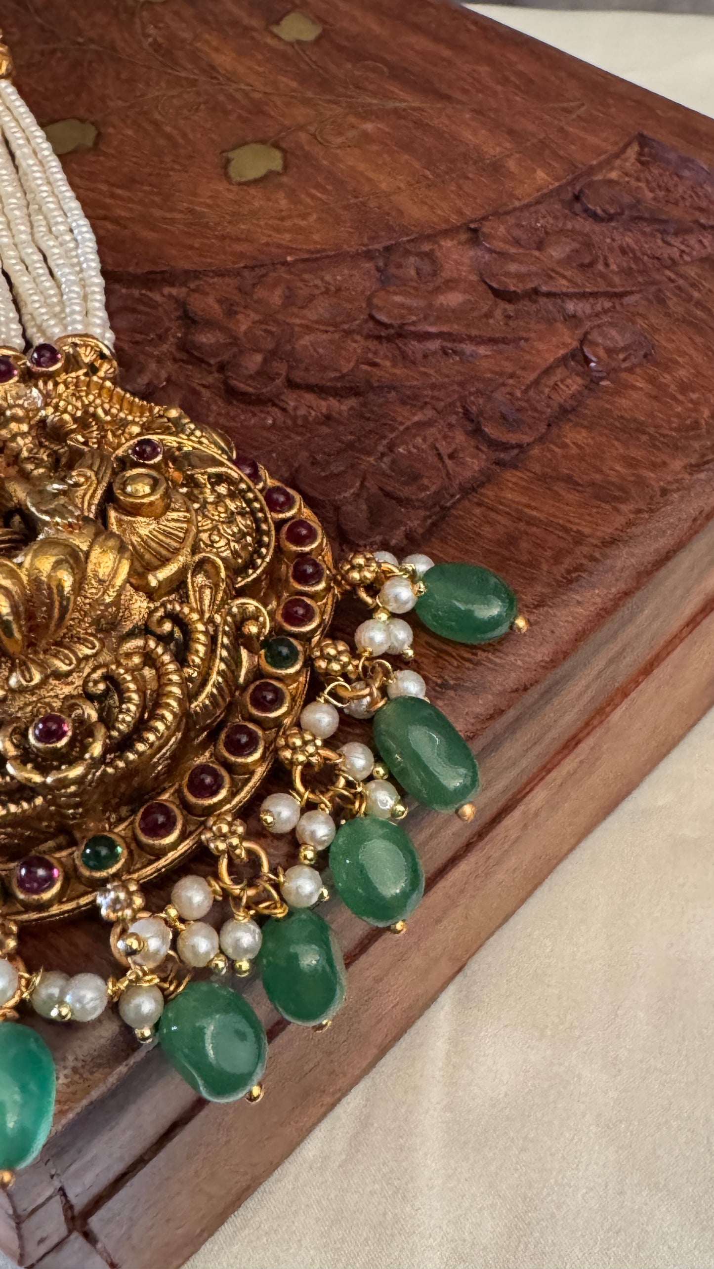 Gold Plated Long White Beaded Temple jewellery Set - Lakshmi Pendant and Jhumka