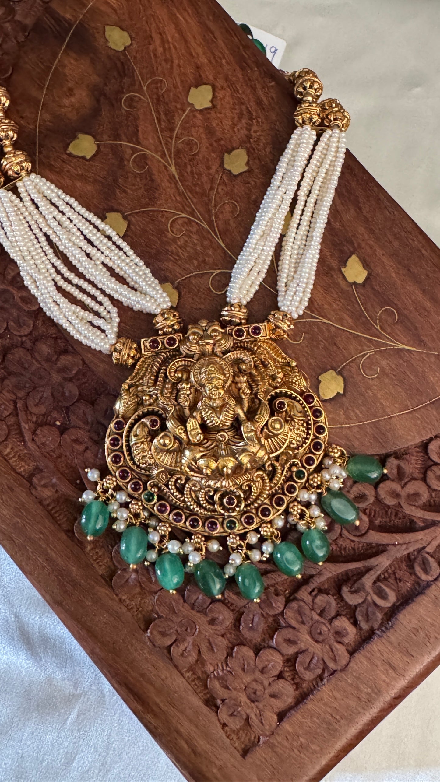 Gold Plated Long White Beaded Temple jewellery Set - Lakshmi Pendant and Jhumka