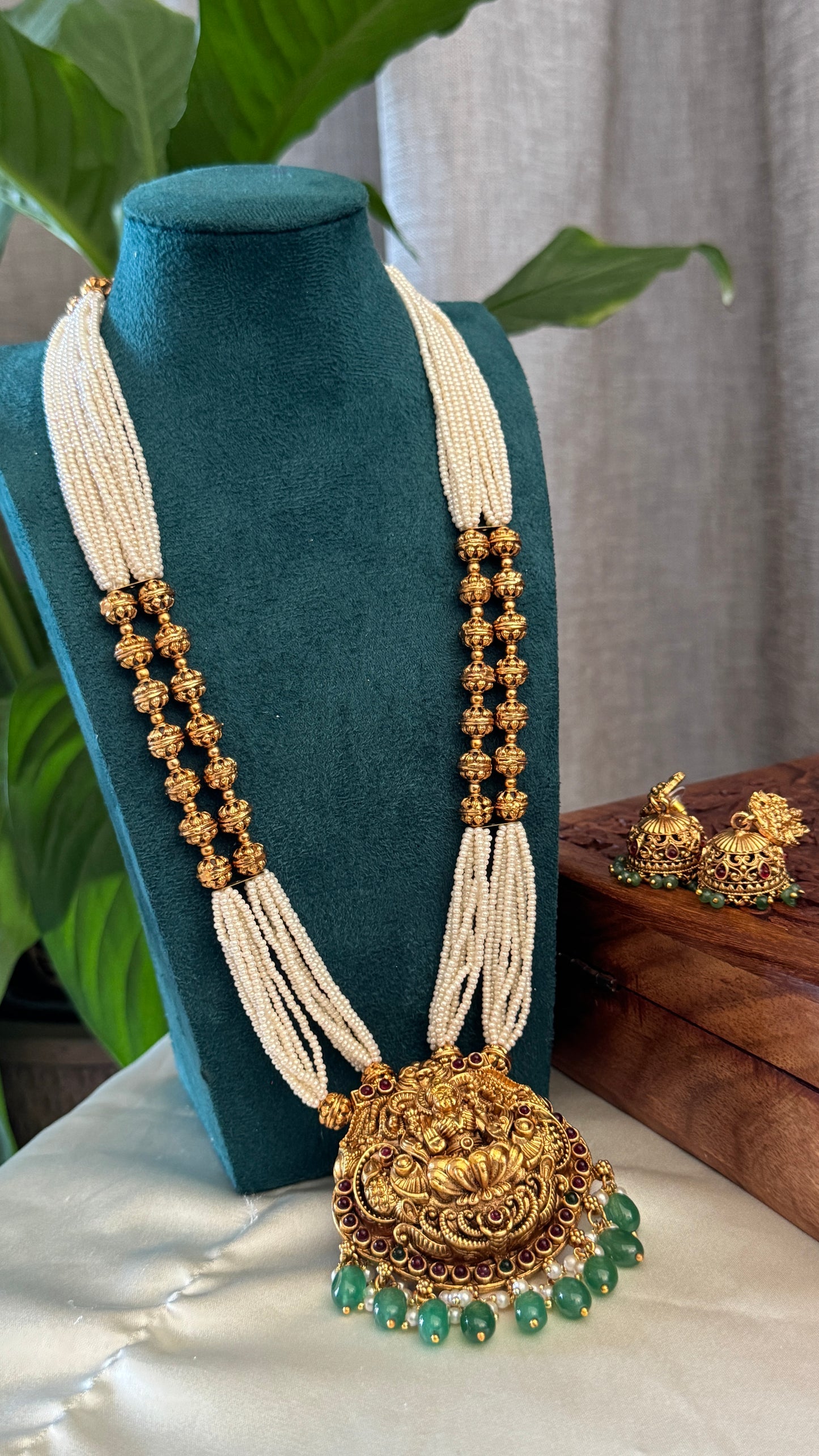 Gold Plated Long White Beaded Temple jewellery Set - Lakshmi Pendant and Jhumka