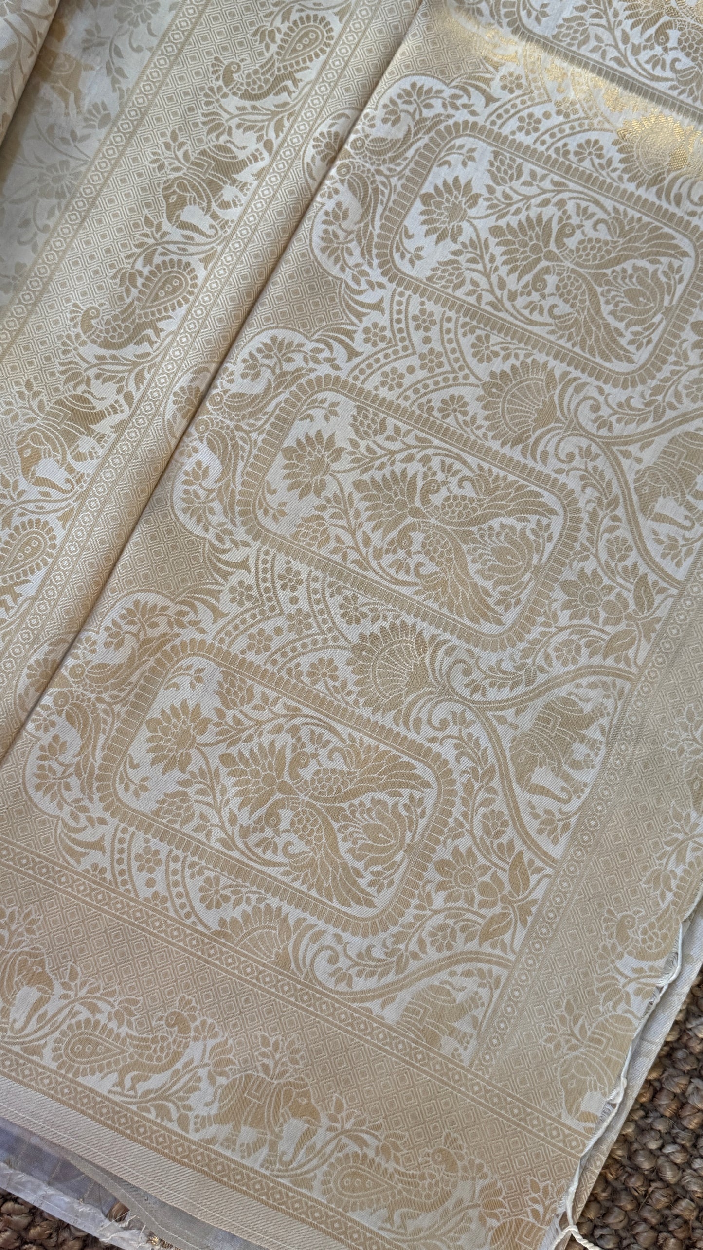 Soft Tissue Silk Saree in Half White Shade with Intricate Animal Motifs