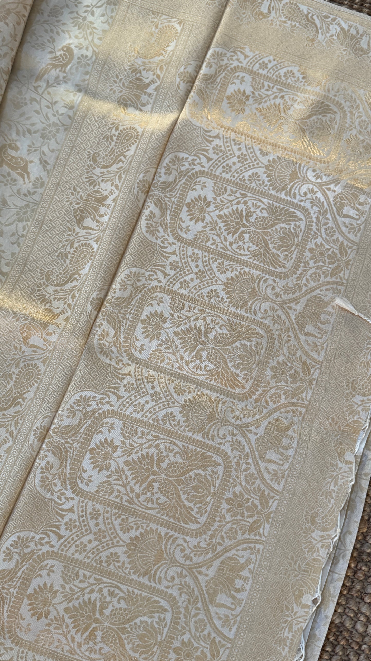 Soft Tissue Silk Saree in Half White Shade with Intricate Animal Motifs