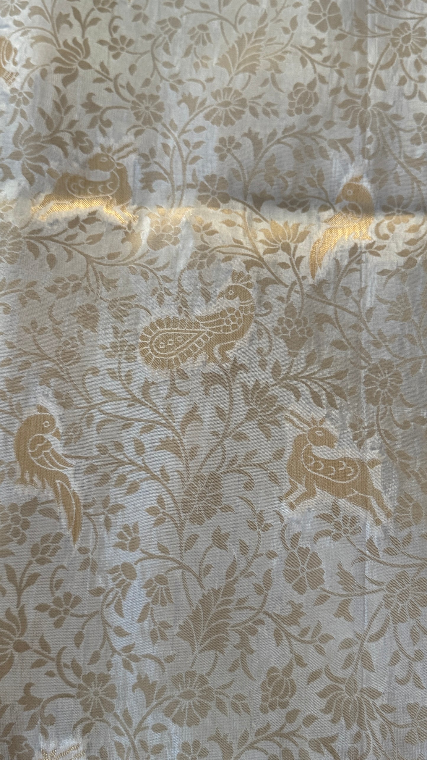 Soft Tissue Silk Saree in Half White Shade with Intricate Animal Motifs