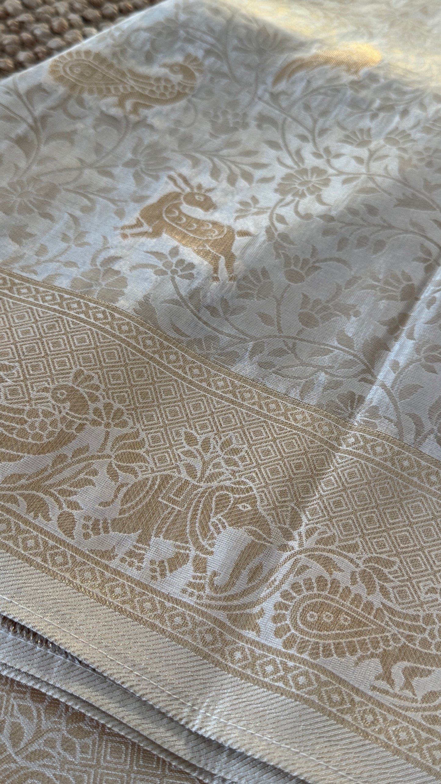 Soft Tissue Silk Saree in Half White Shade with Intricate Animal Motifs