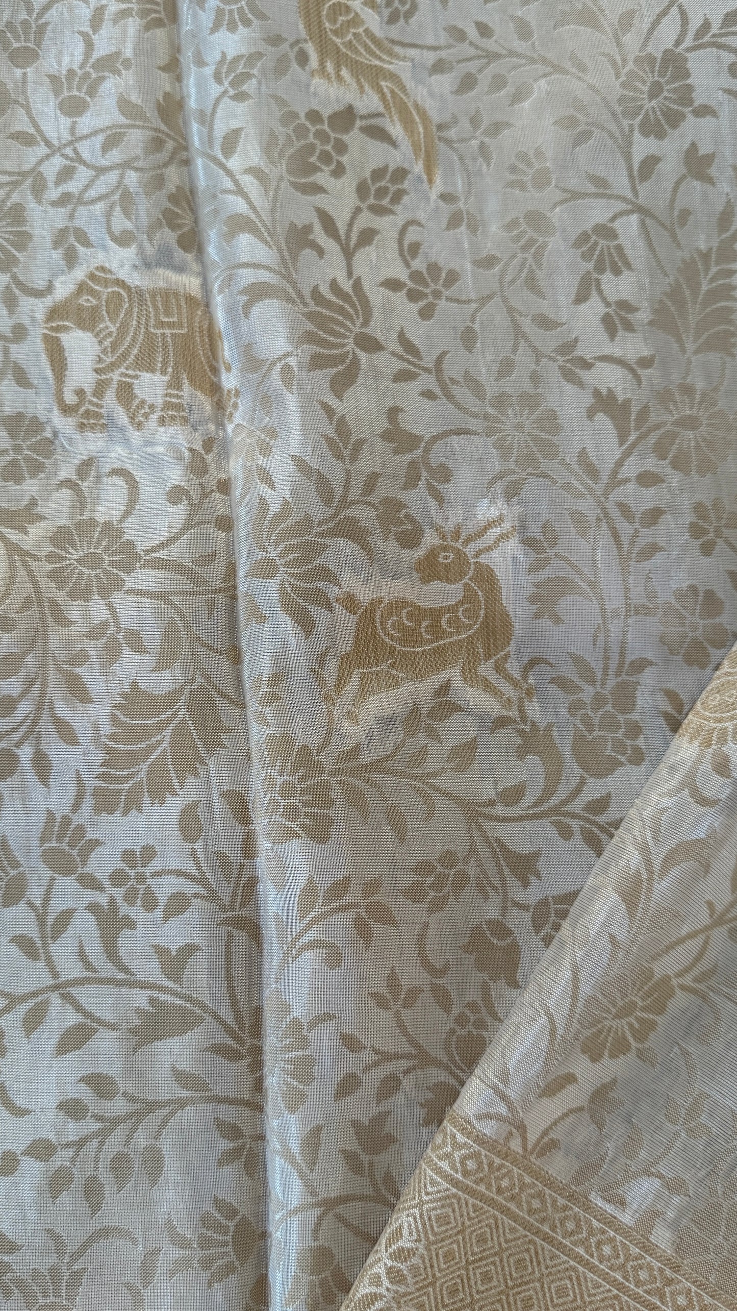 Soft Tissue Silk Saree in Half White Shade with Intricate Animal Motifs