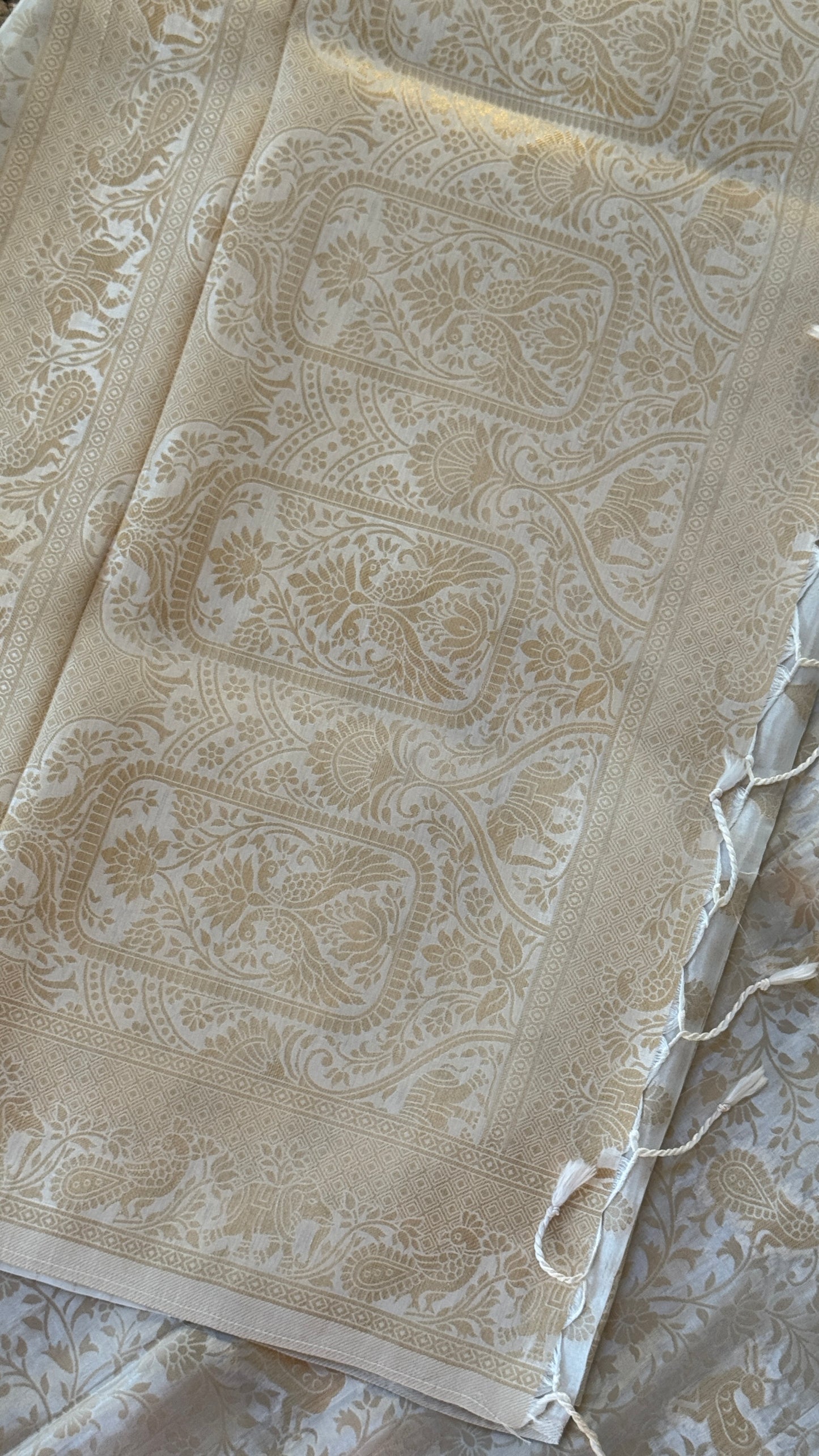 Soft Tissue Silk Saree in Half White Shade with Intricate Animal Motifs