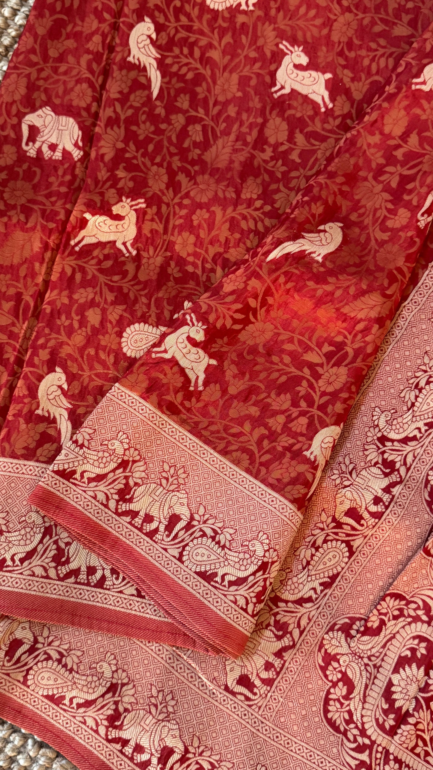 Soft Tissue Silk Saree in Unique Rust Shade with Intricate Animal Motifs