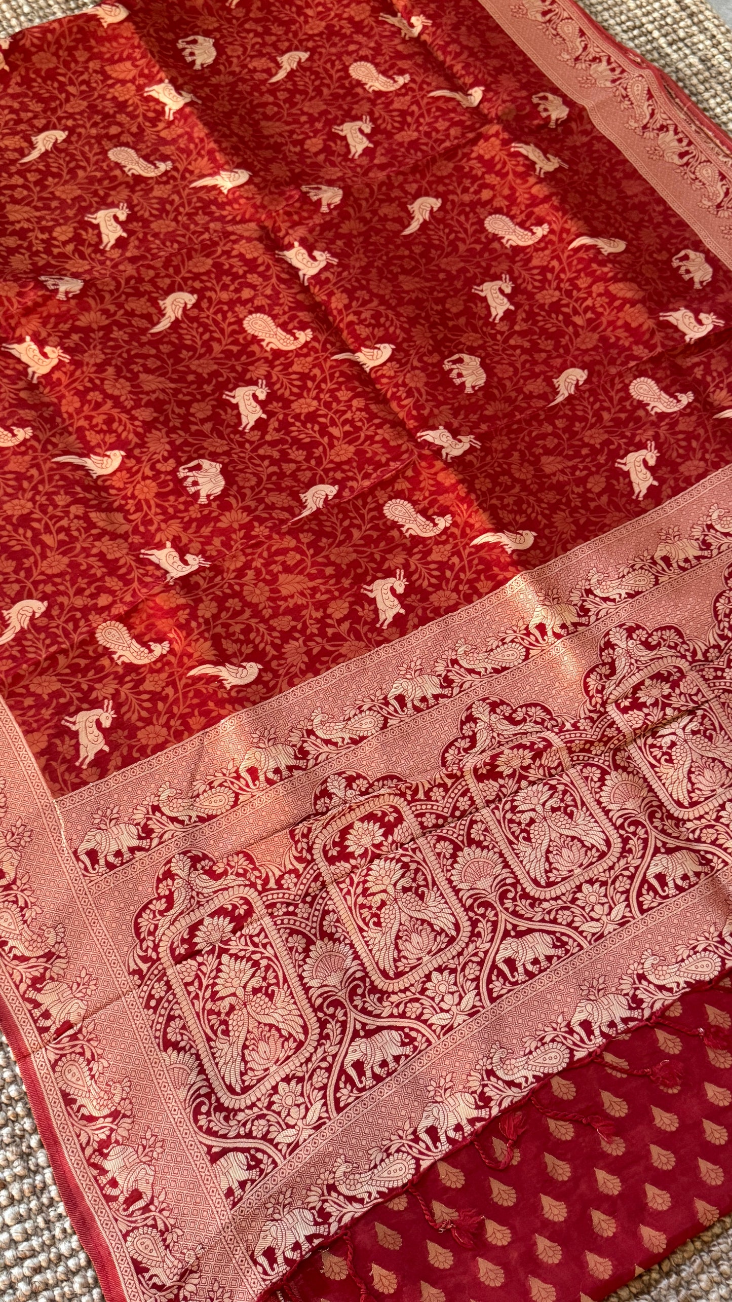 Soft Tissue Silk Saree in Unique Rust Shade with Intricate Animal Motifs