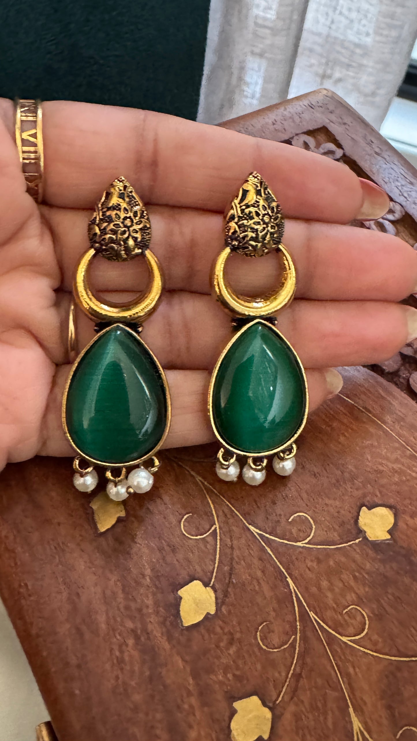 Antique Black Gold Finish Jhumka with Green Stone and Pearl Drops