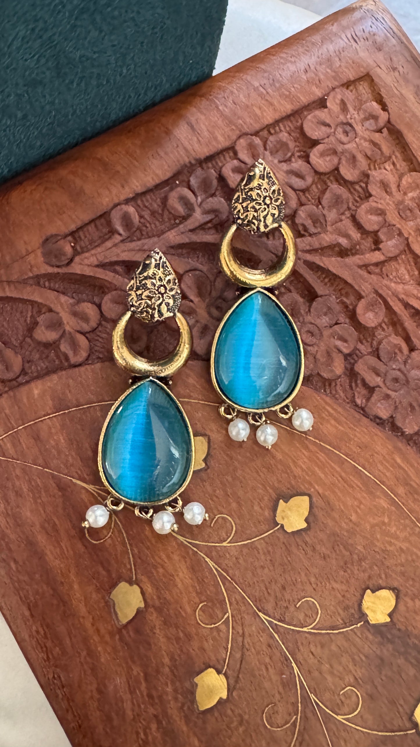 Antique Black Gold Finish Jhumka with Blue Stone and Pearl Drops