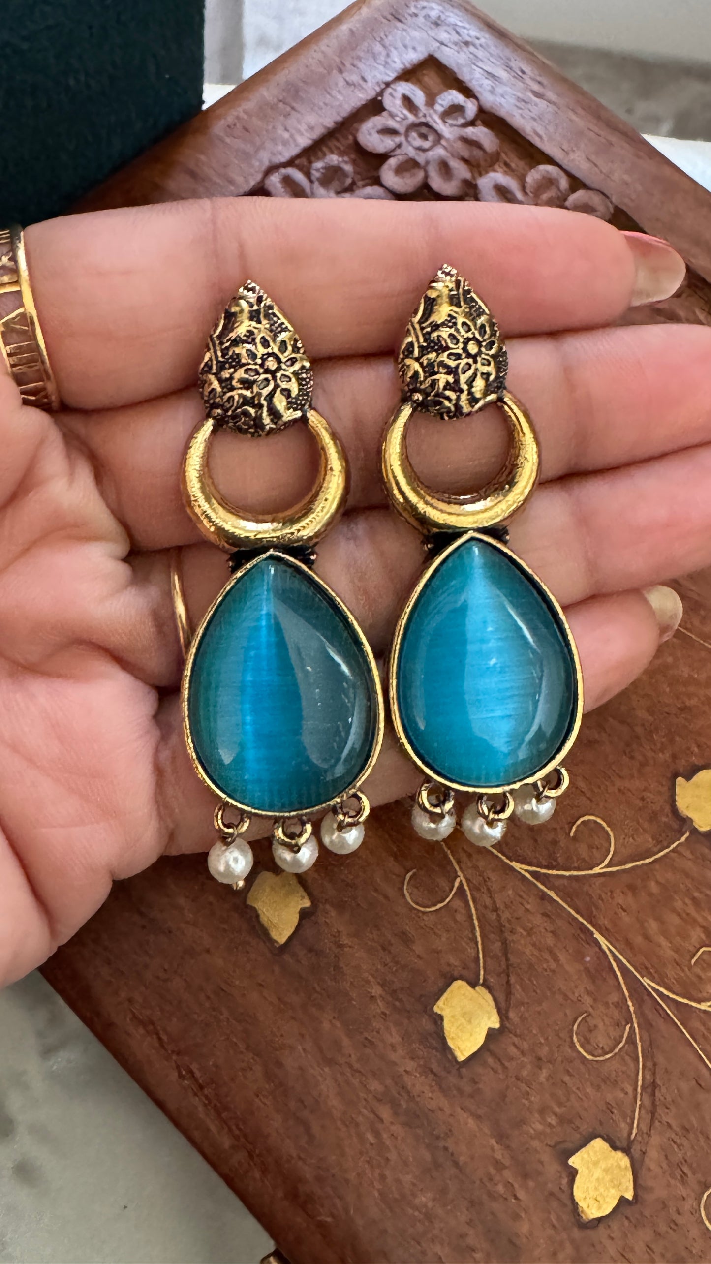 Antique Black Gold Finish Jhumka with Blue Stone and Pearl Drops