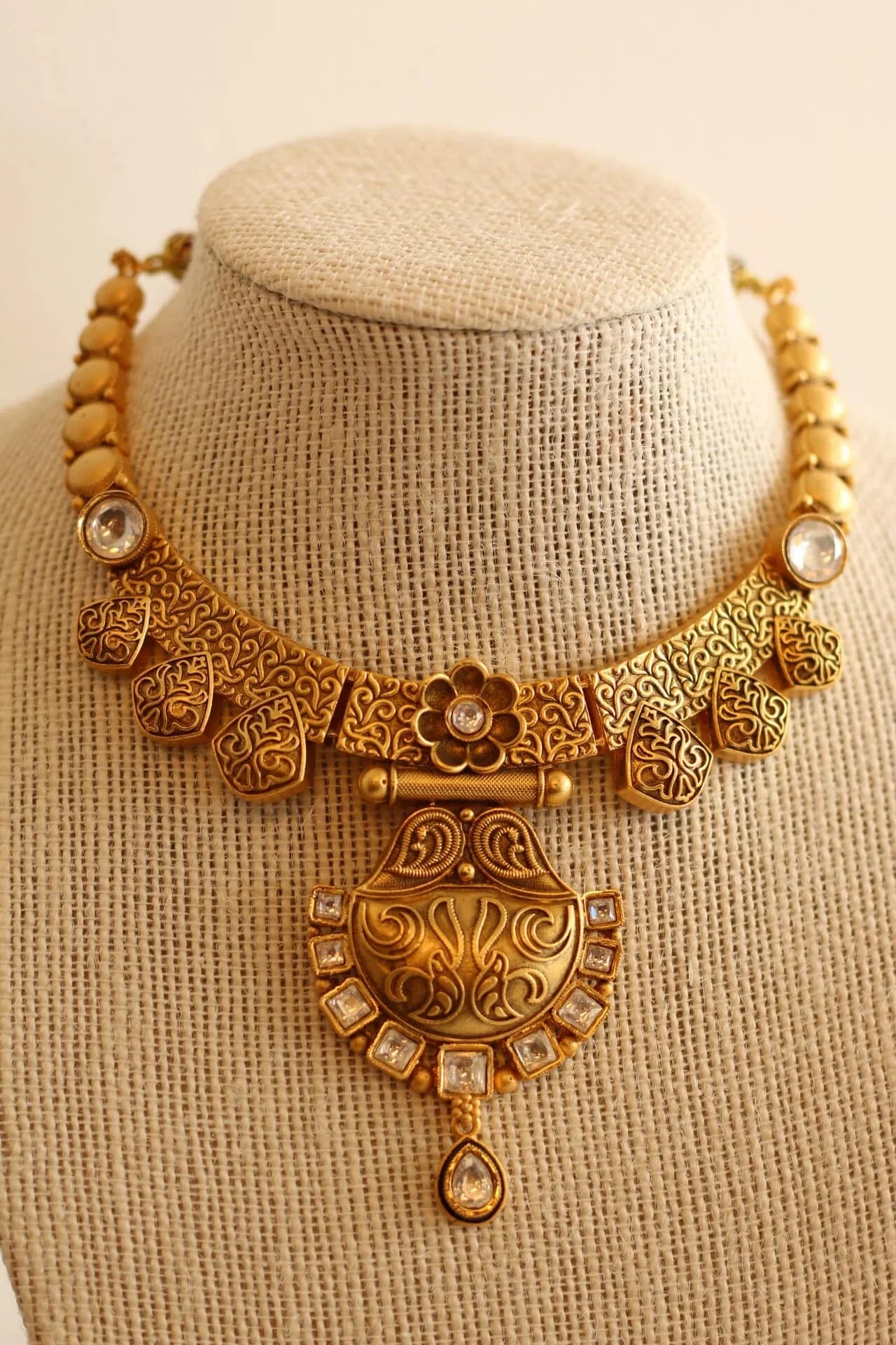 Gorgeous Matt gold necklace set with white stone details