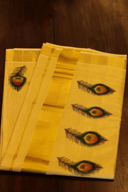 Onam saree with gold border and peacock feather design
