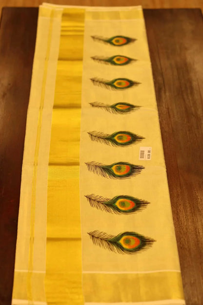 Onam saree with gold border and peacock feather design