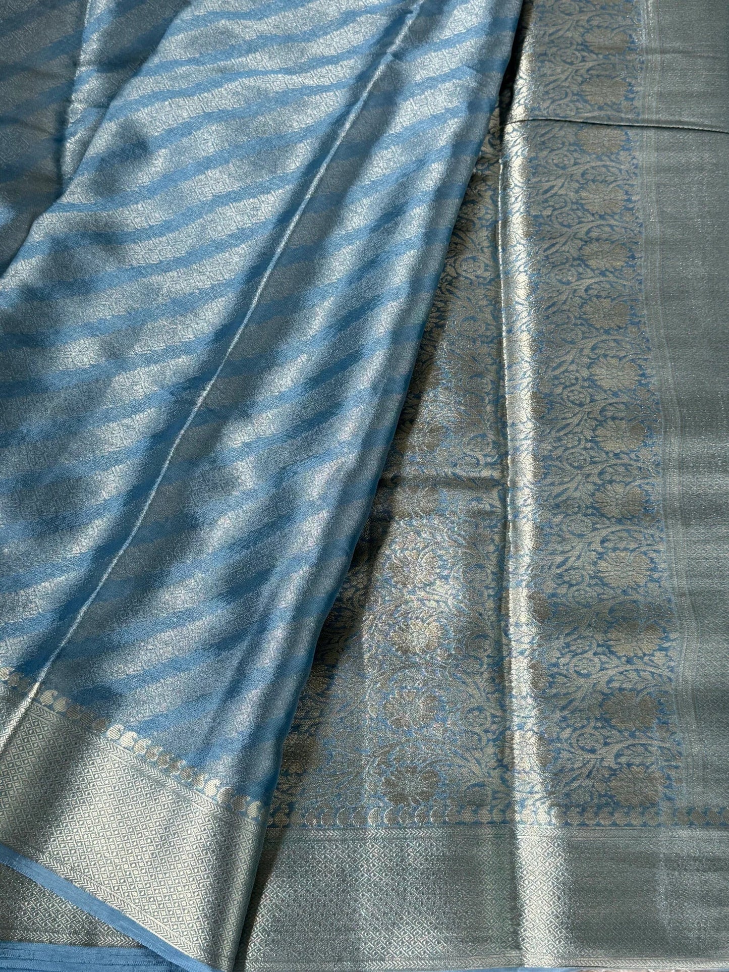Shimmery Georgette Saree in Bluish grey with Silver Zari Border