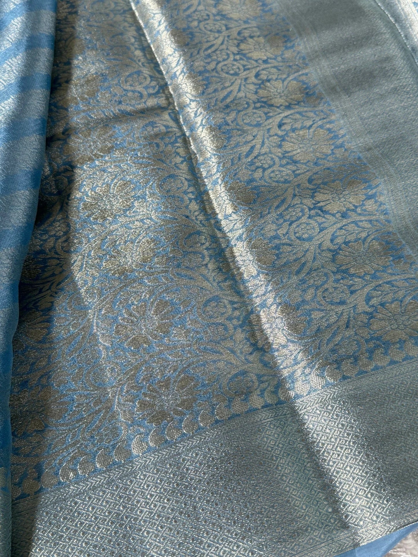 Shimmery Georgette Saree in Bluish grey with Silver Zari Border