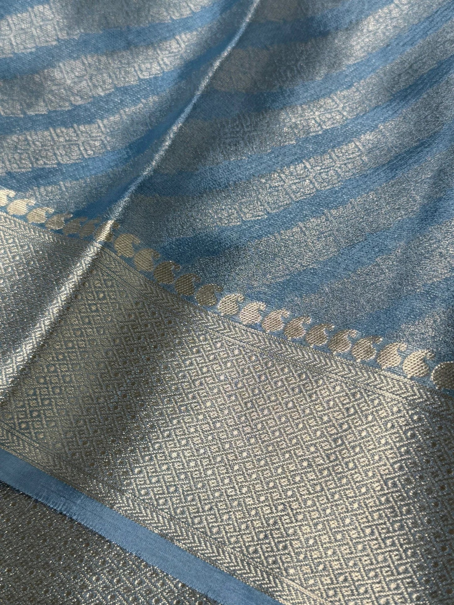 Shimmery Georgette Saree in Bluish grey with Silver Zari Border