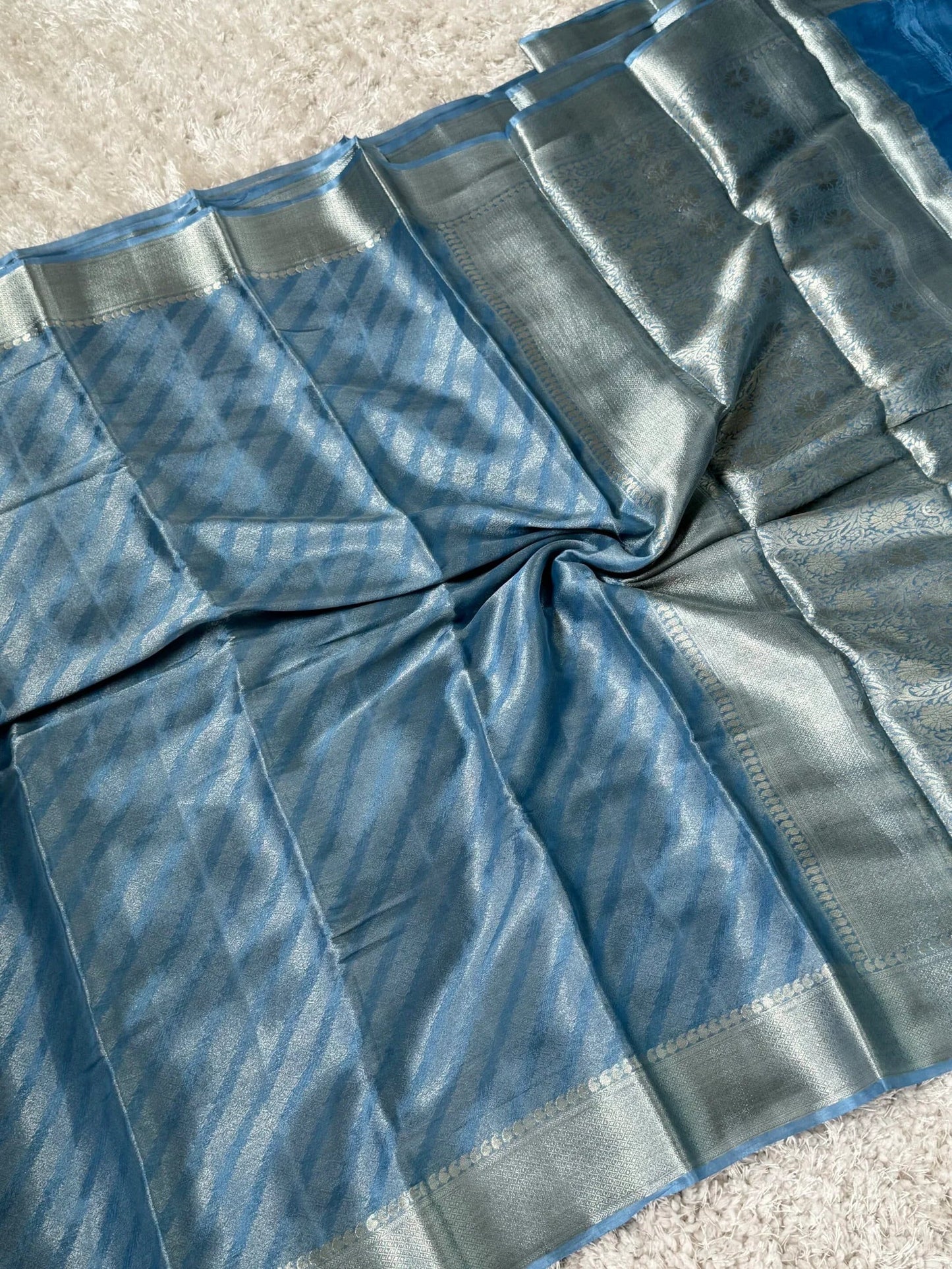 Shimmery Georgette Saree in Bluish grey with Silver Zari Border