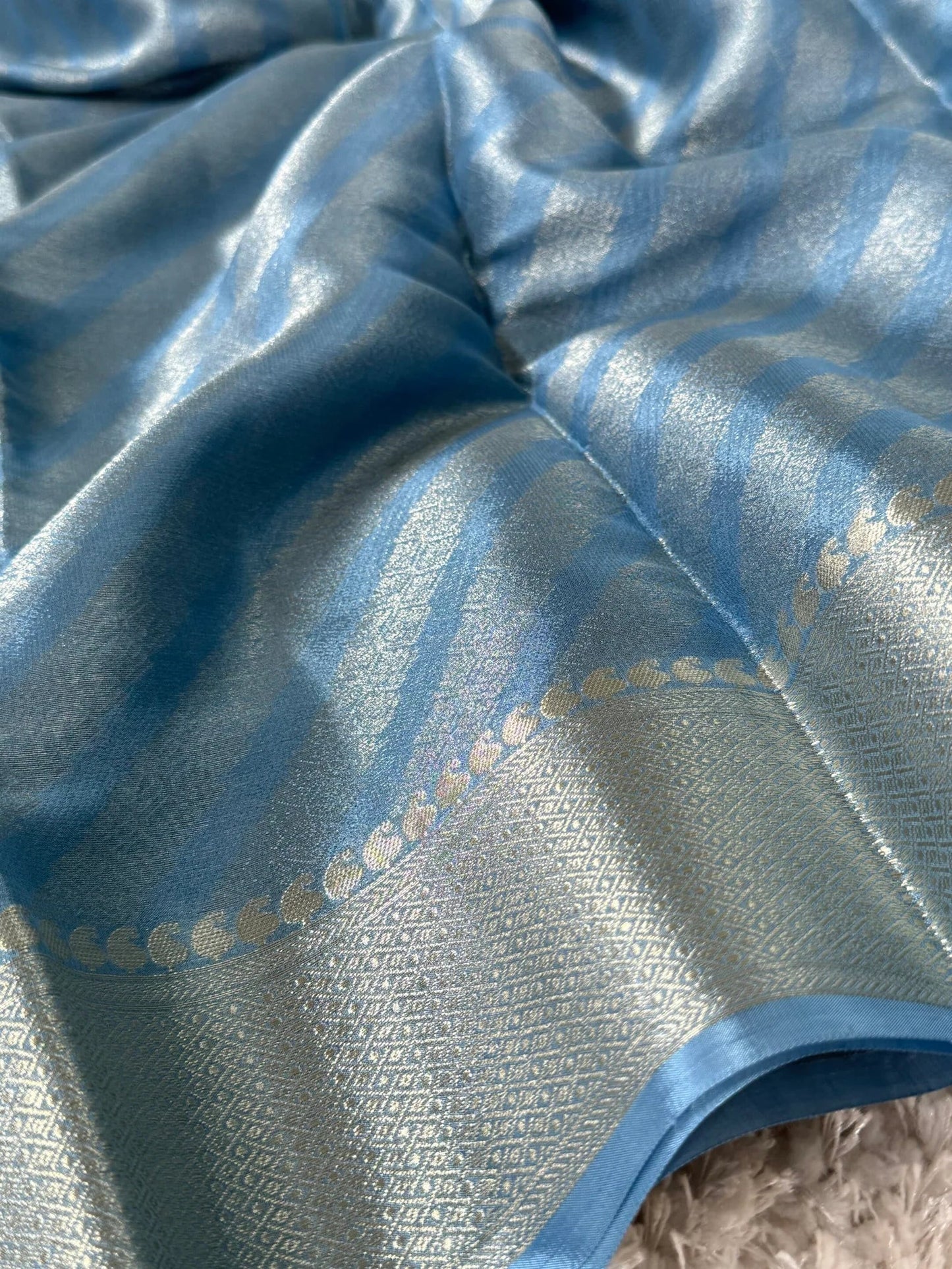 Shimmery Georgette Saree in Bluish grey with Silver Zari Border