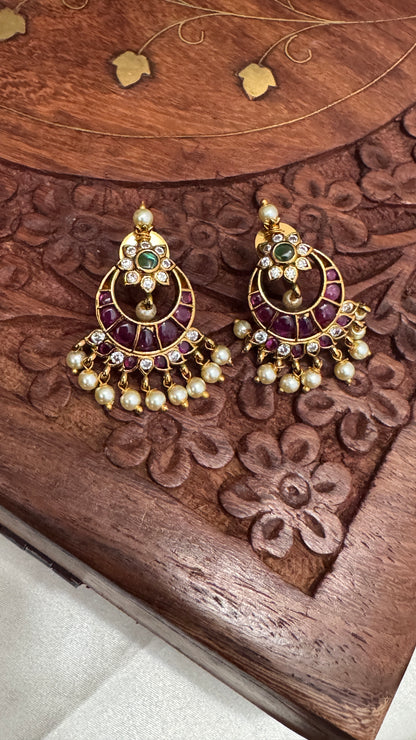 Temple Jewellery with emerald, ruby and white color stone details.