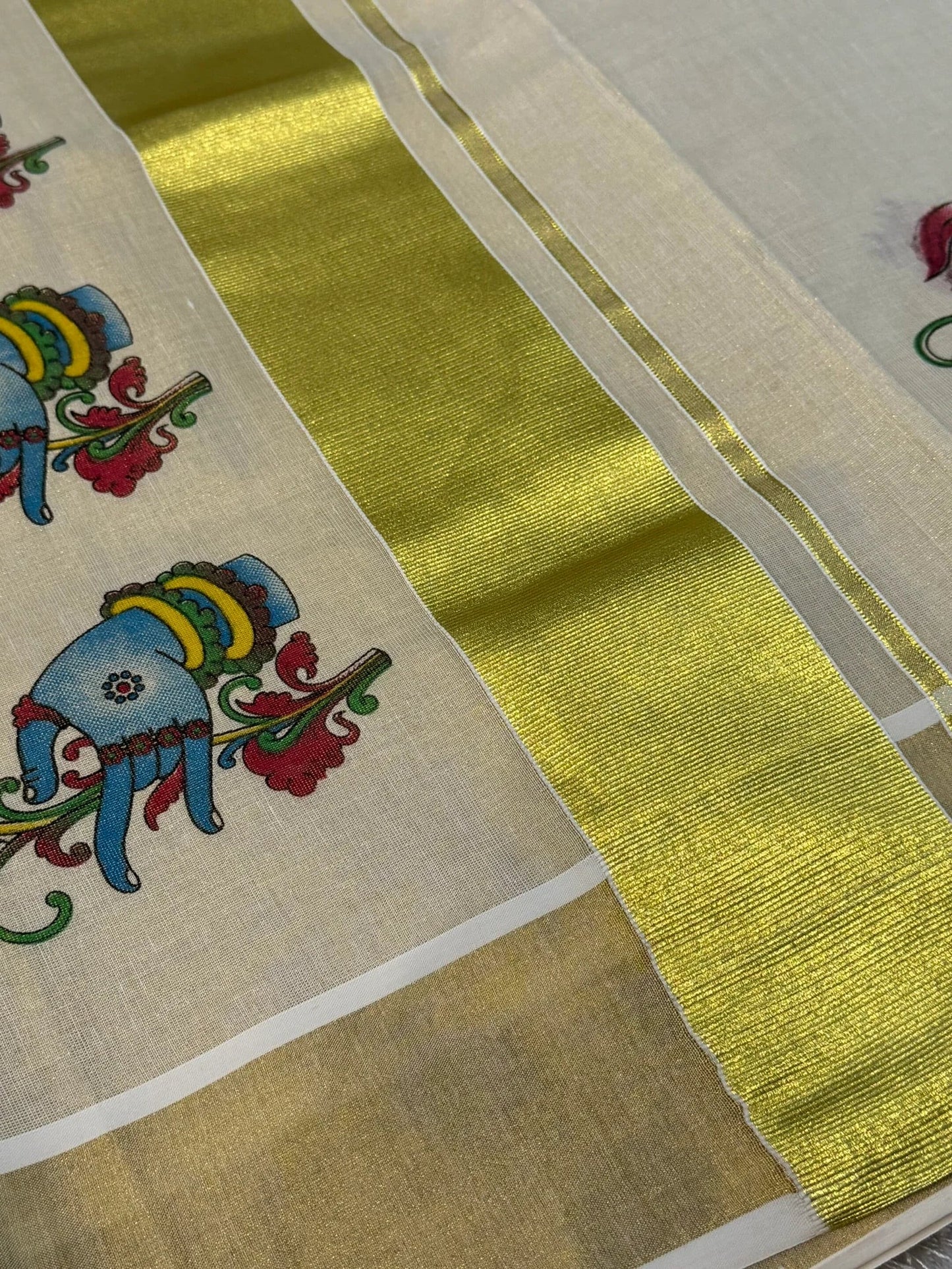 Onam tissue silk saree with gold zari border