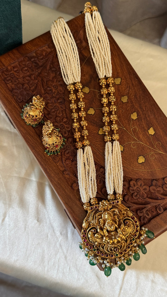 Gold Plated Long White Beaded Temple jewellery Set - Lakshmi Pendant and Jhumka