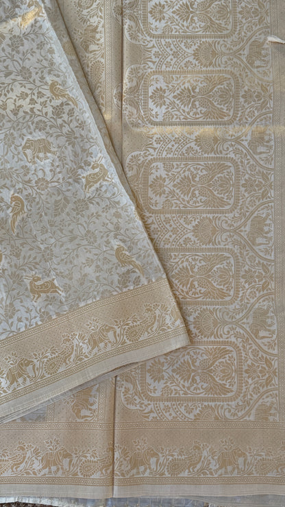 Soft Tissue Silk Saree in Half White Shade with Intricate Animal Motifs