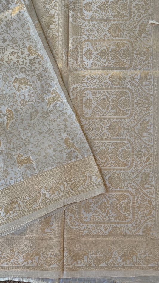 Soft Tissue Silk Saree in Half White Shade with Intricate Animal Motifs