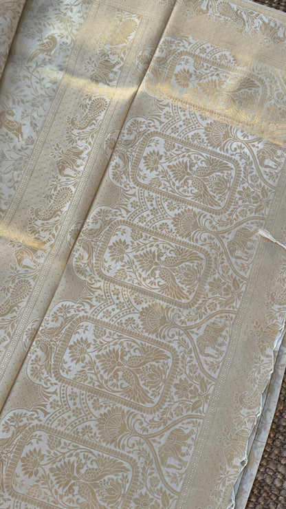 Soft Tissue Silk Saree in Half White Shade with Intricate Animal Motifs