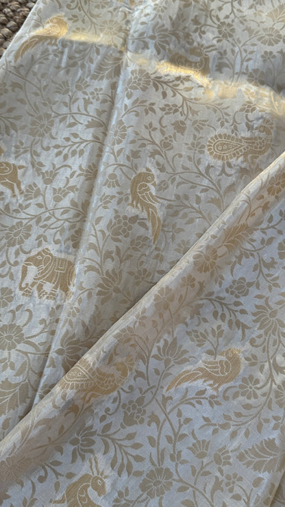 Soft Tissue Silk Saree in Half White Shade with Intricate Animal Motifs