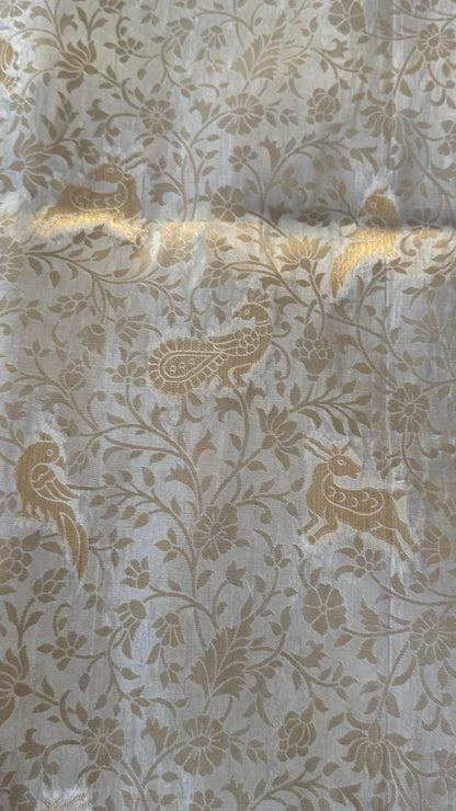 Soft Tissue Silk Saree in Half White Shade with Intricate Animal Motifs