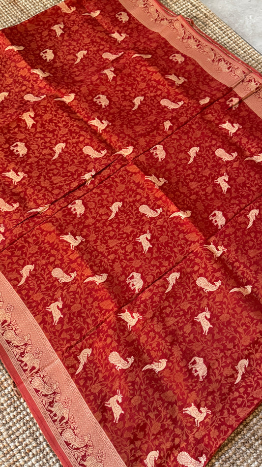 Soft Tissue Silk Saree in Unique Rust Shade with Intricate Animal Motifs