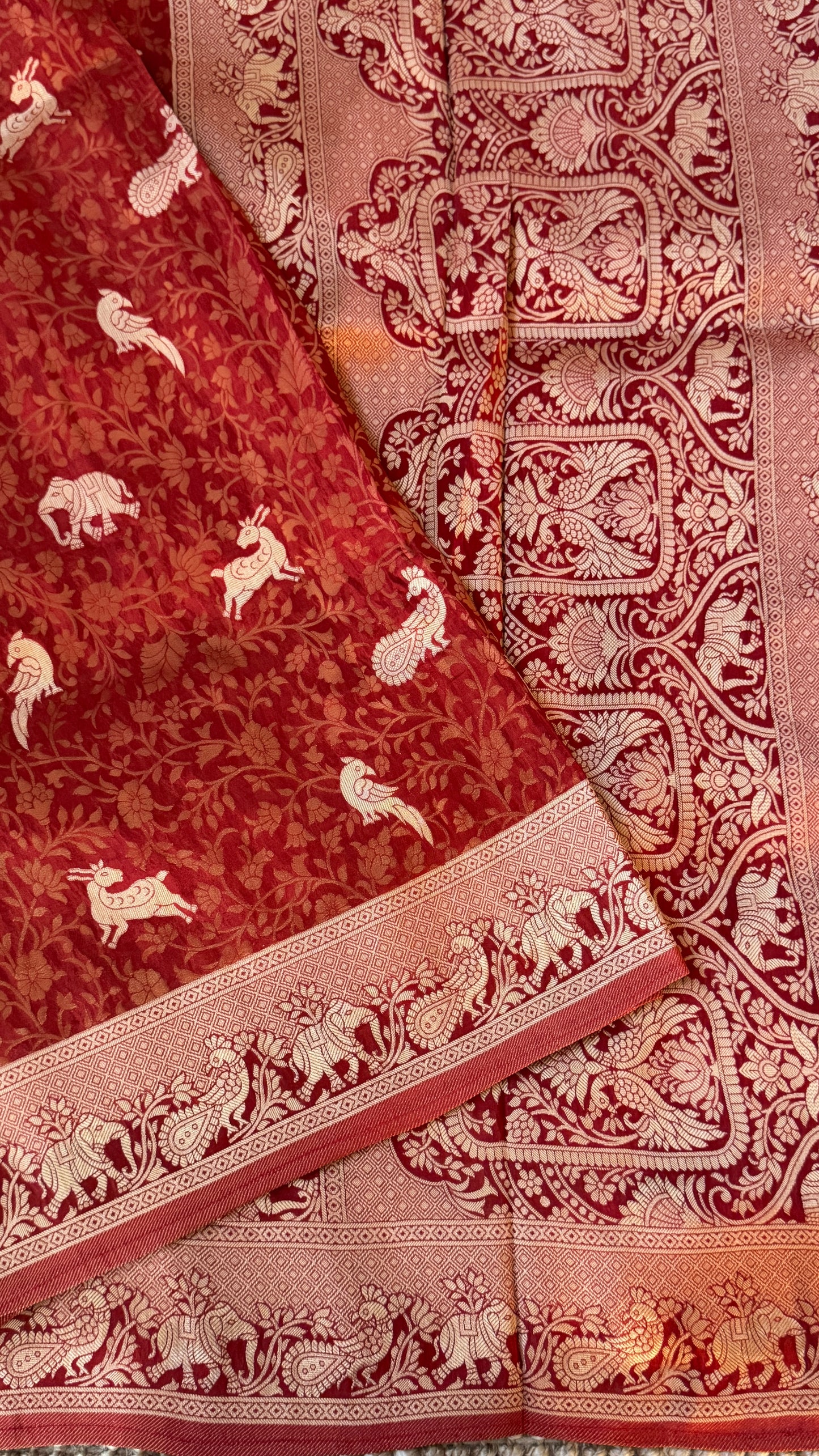 Soft Tissue Silk Saree in Unique Rust Shade with Intricate Animal Motifs